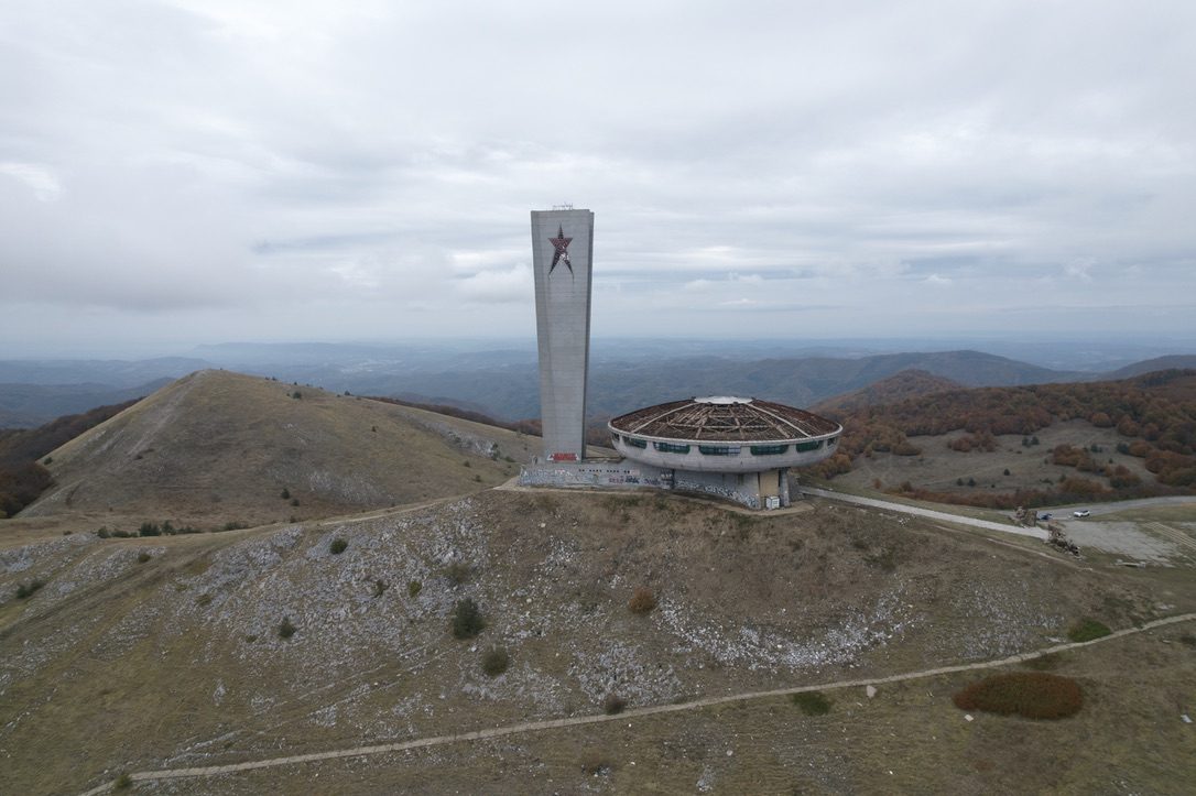 The Buzludzha monument on its hill under an overcast sky